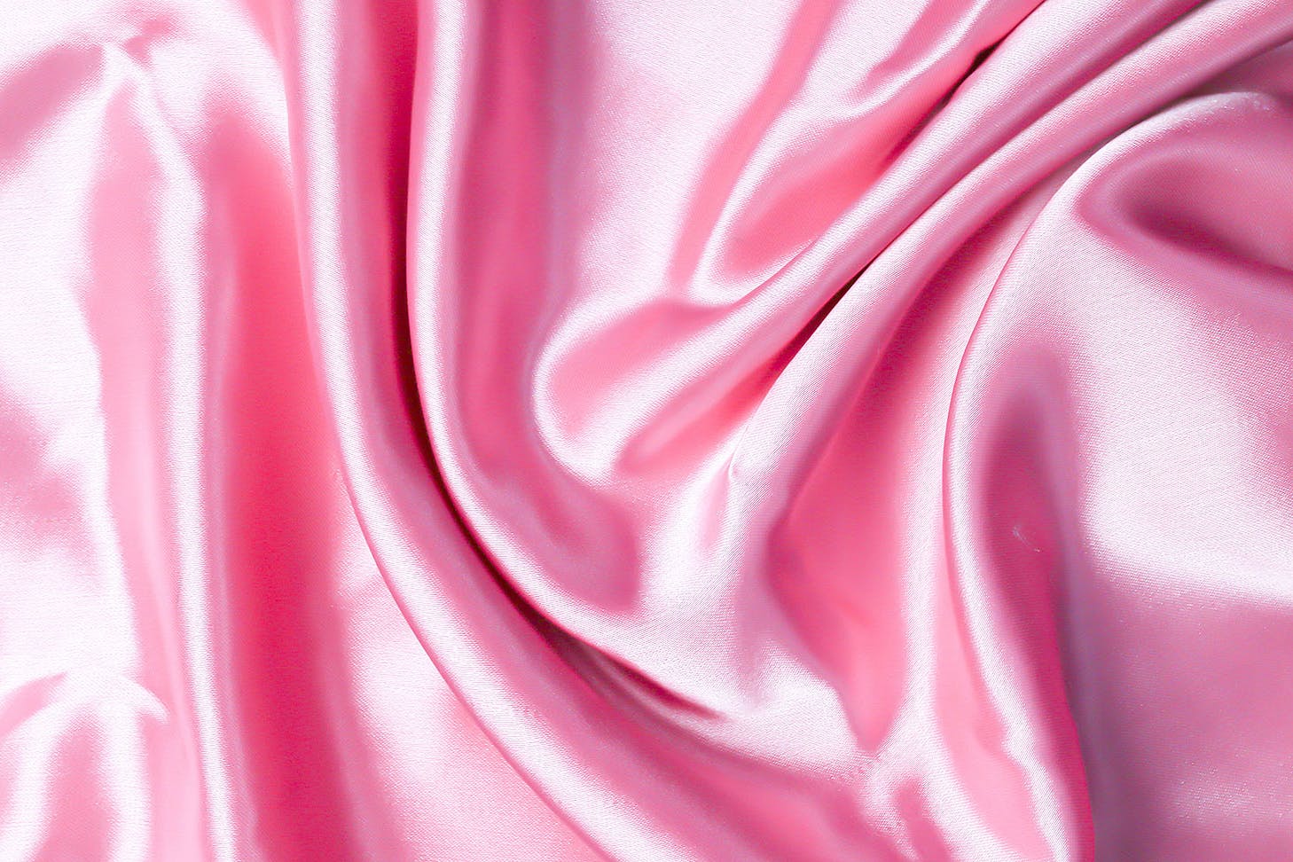 A ruched pink silk pillowcase looks luscious.